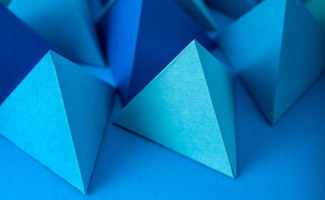 Artistic image of blue geometric shapes on a blue surface
