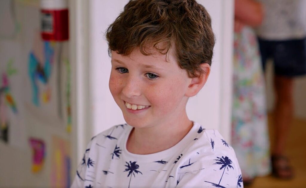 A young boy smiling