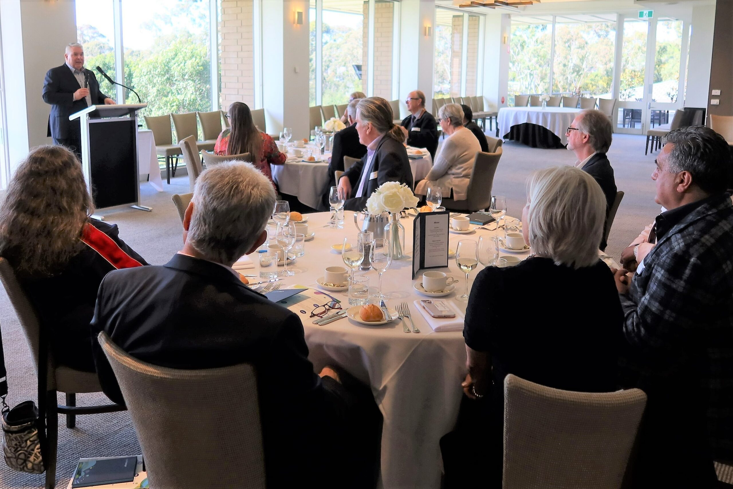 Board and directors talking at an event