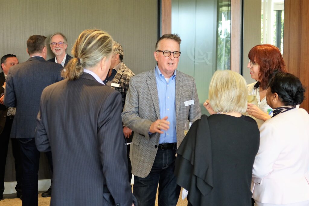 Board and directors talking at an event