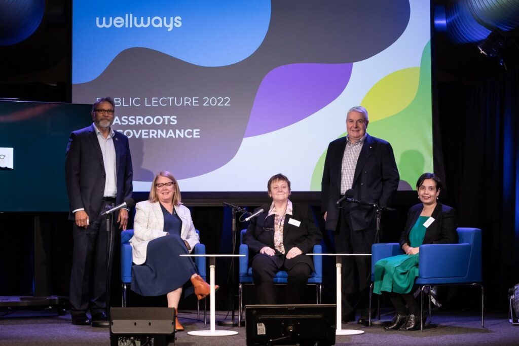 The panel of the 2022 Woodcock Public Lecture on stage