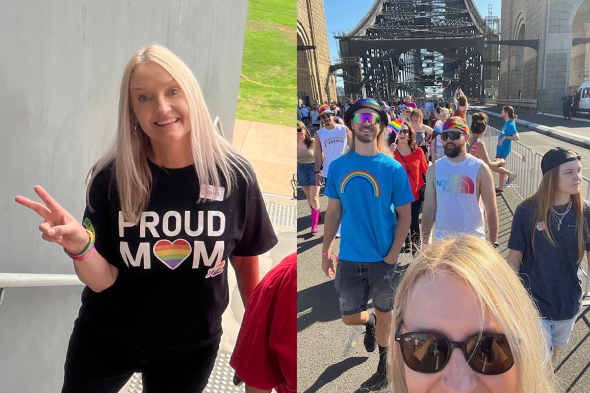 People wearing rainbow colours walking on a bridge