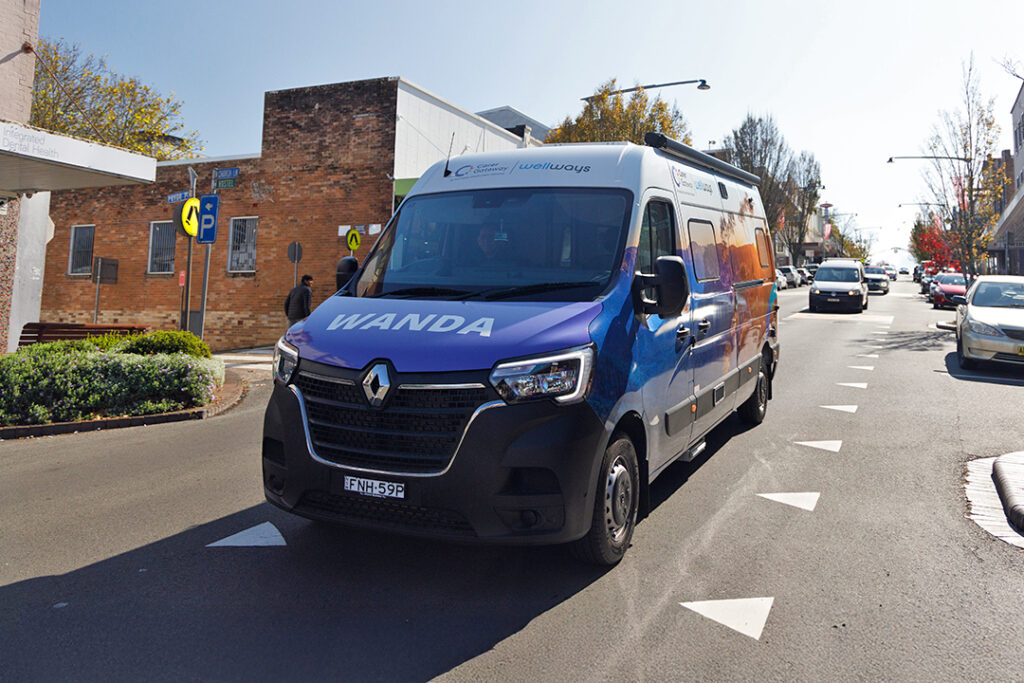A colourful van with the letters WANDA on the bonnet
