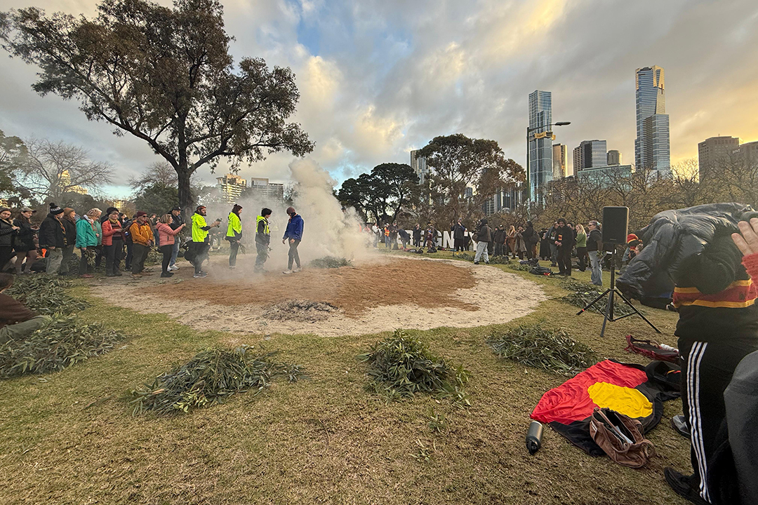 A gathering of people performing a smoking ceremony near Melbourne CBD