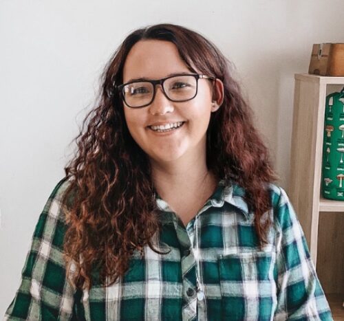Young brunette person with glasss