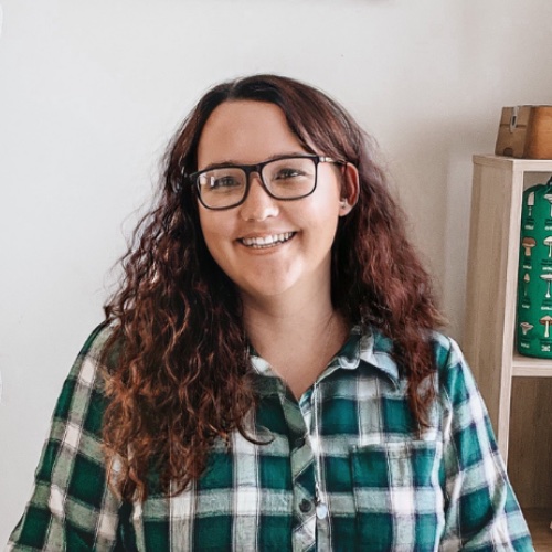 Young brunette person with glasss