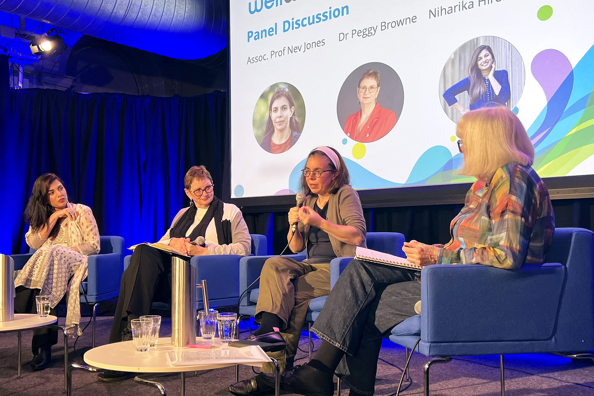 A panel of people speaking at the Woodcock Lecture