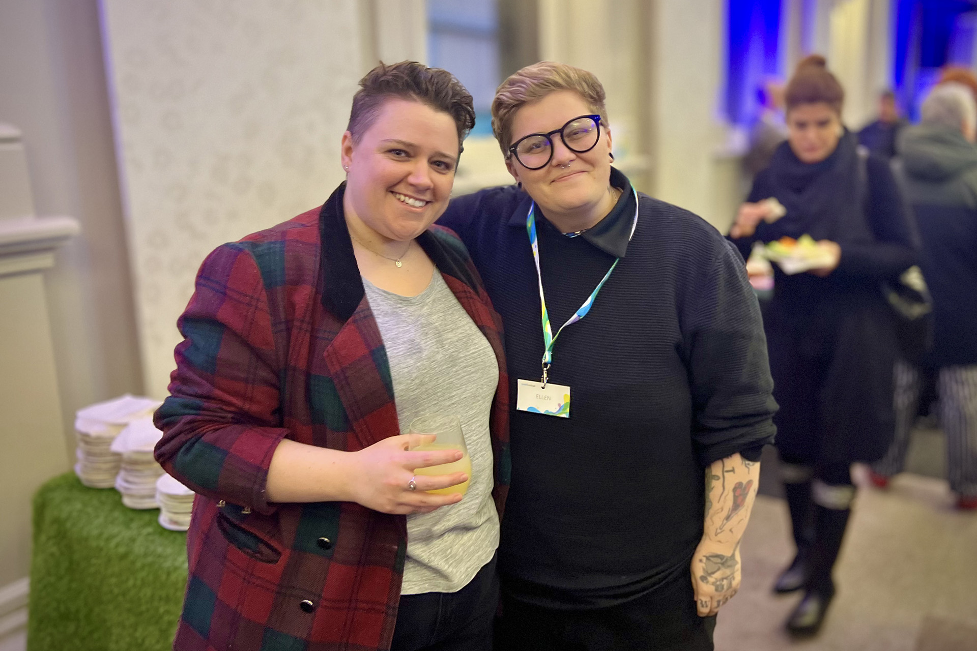Two people posing for a photo at an event.
