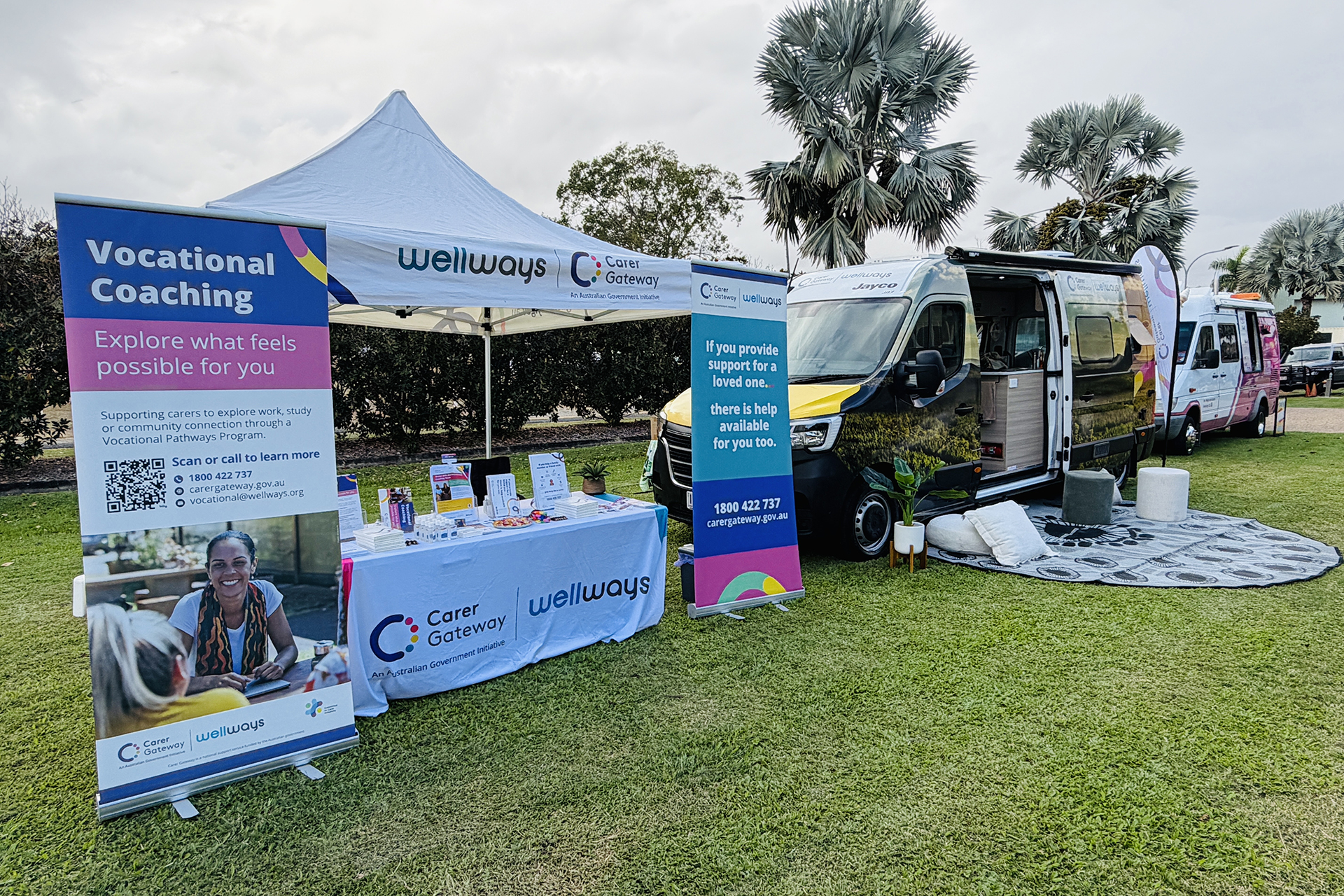 A Wellways Carer Gateway marquee and Wanda van side-by-side, set up for an event on a grass field