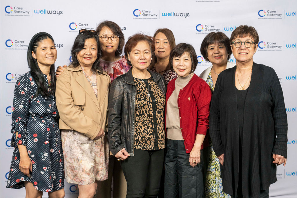 Group of poeple standing and posing for a photo